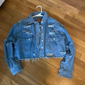Cropped Jean jacket with stylized rips